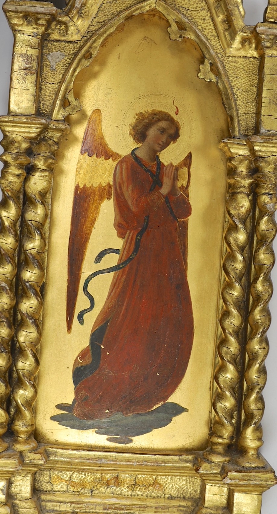 Manner of Fra Angelico, late 19th century, a pair of oils and gilt on panel, Archangels, mounted in ornate carved gilt wood frames (one a.f), 54 x 18cm total